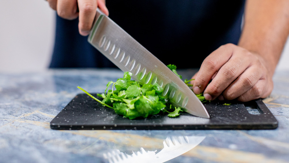 chopping veggies for cilantro lime rice recipe