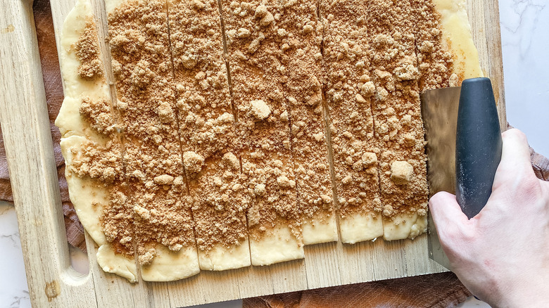 cutting cinnamon roll dough