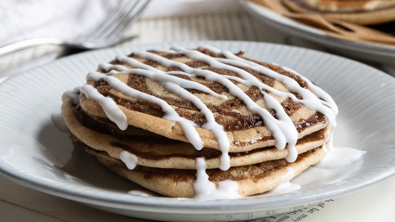 glazed cinnamon roll pancake on plate 