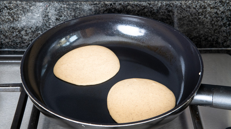 pancakes in pan on stove 