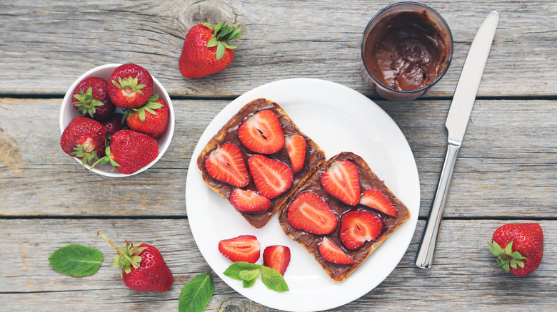 Strawberries with Nutella on plate