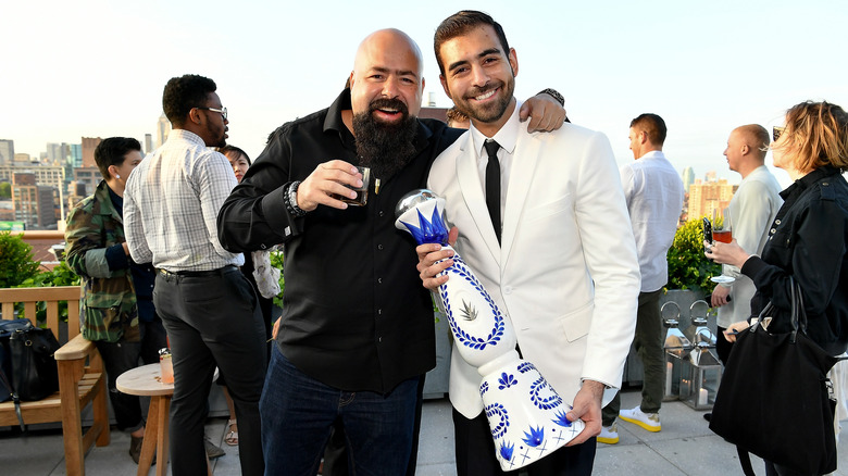 Arturo Lomeli smiling with friend