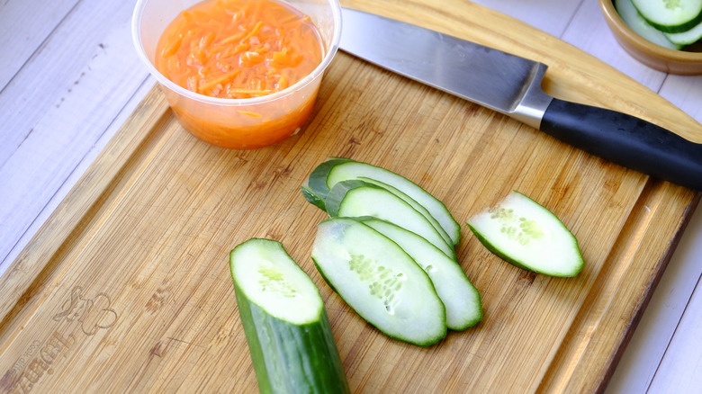 slices of cucumber on a cutting board