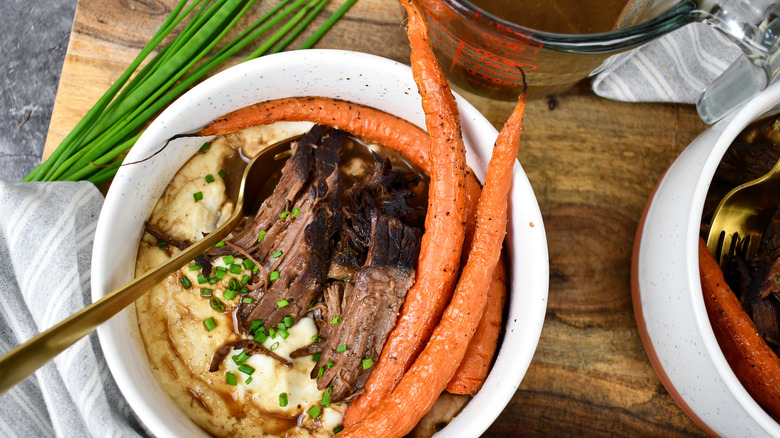 braised sirloin with mashed potatoes, carrots, and chives