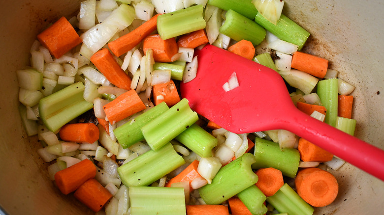 sweating the onions, garlic, celery, and carrots