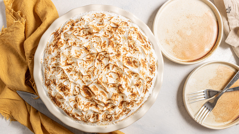 Canadian flapper pie with two plates and forks on the side 