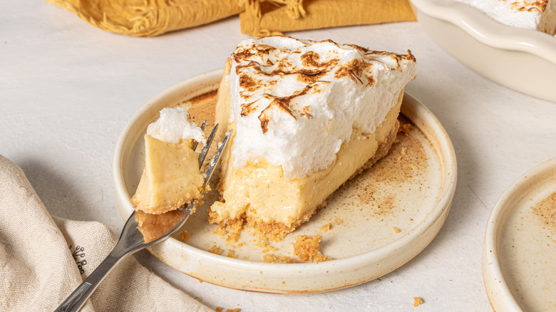 Canadian flapper pie slice on plate with bite removed