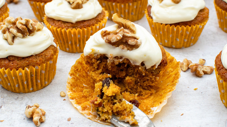 carrot cake cupcake with bite removed with fork