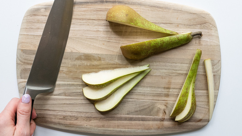 sliced pear and knife