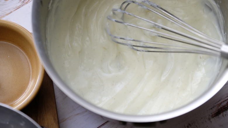 whisking custard in dish 