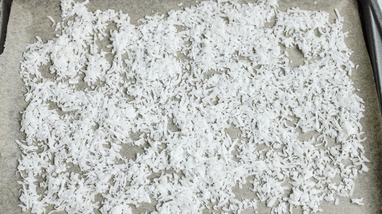 coconut flakes on baking sheet