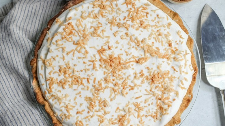 coconut cream pie with coconut flakes