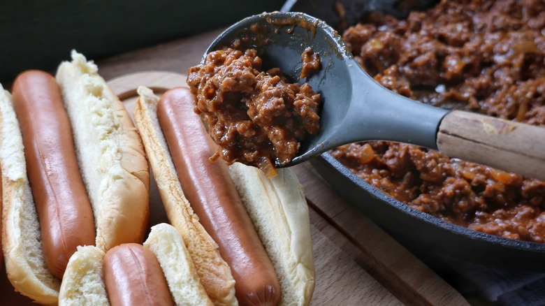 topping hot dog with coney sauce