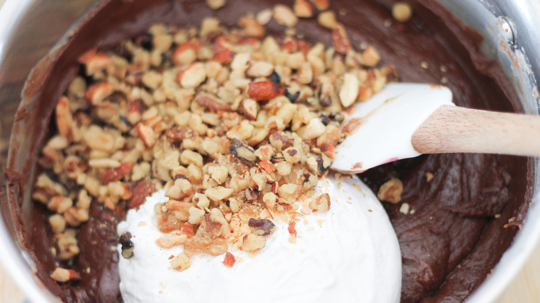 stirring nuts into the fudge