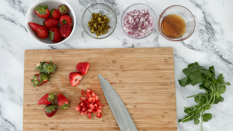 strawberries diced on cutting board