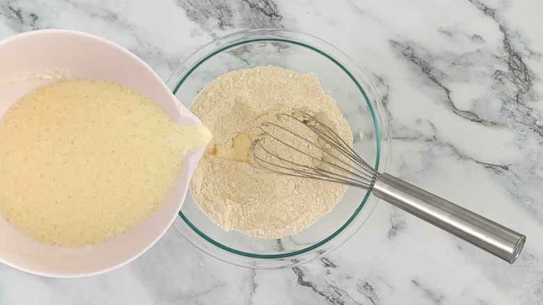 liquid pouring into flour mixture