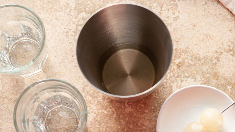 a cocktail shaker and glasses