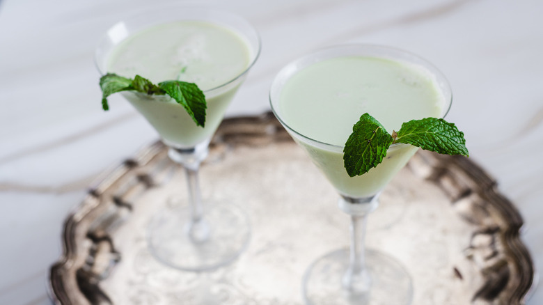 two cocktails on silver tray