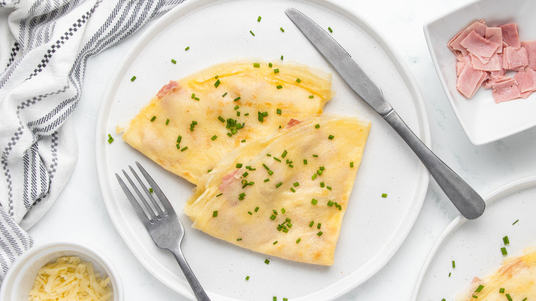 cheese and ham crepes on plate