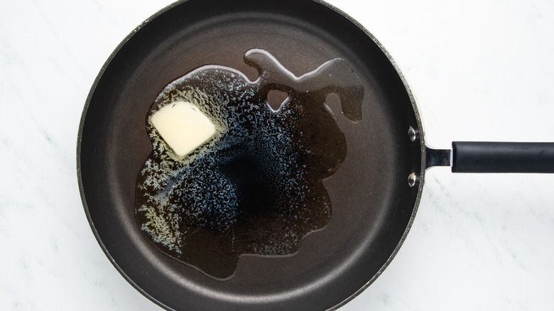 butter and oil melting in pan