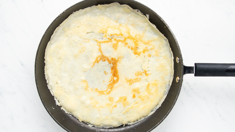 crepe in frying pan