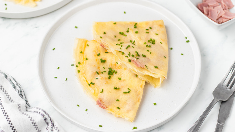 cheese and ham crepes on plate