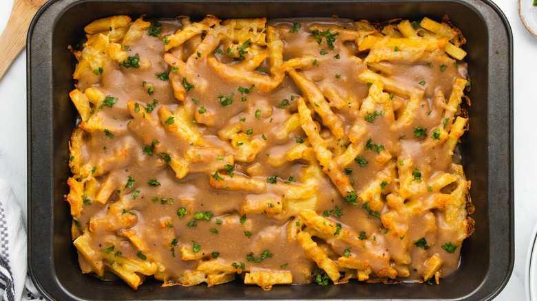 Disco fries with gravy in baking dish