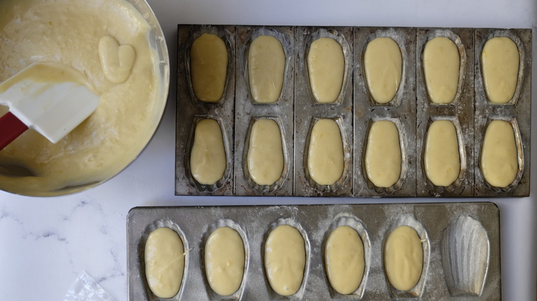 Filling madeleine molds with batter