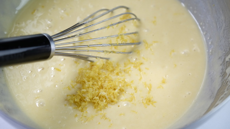 Whisking madeleine batter in bowl