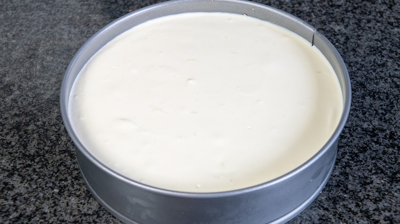 uncooked cheesecake in tin 