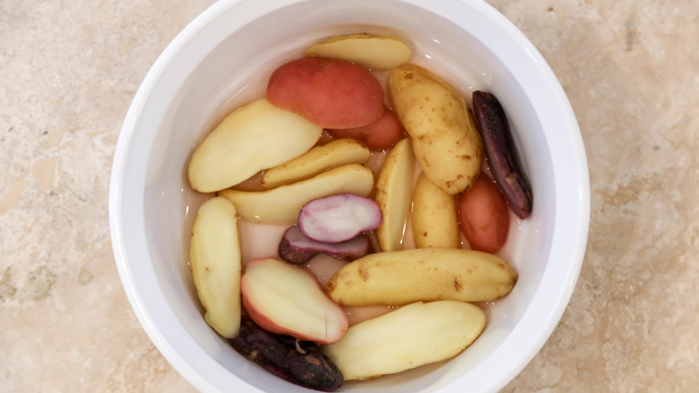 fingerling potatoes in dish with water