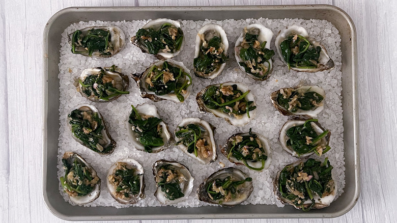 oysters on tray with spinach