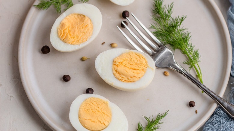 pickled eggs on plate with fork