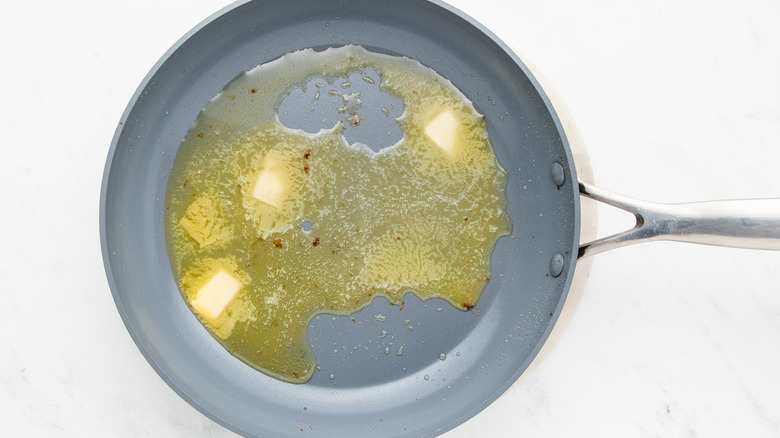 butter melting in frying pan