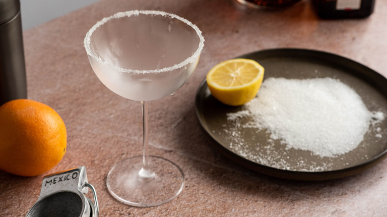 glass with sugar rim with orange and lemon