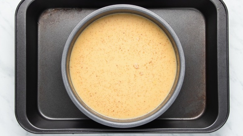 strained custard in cake pan