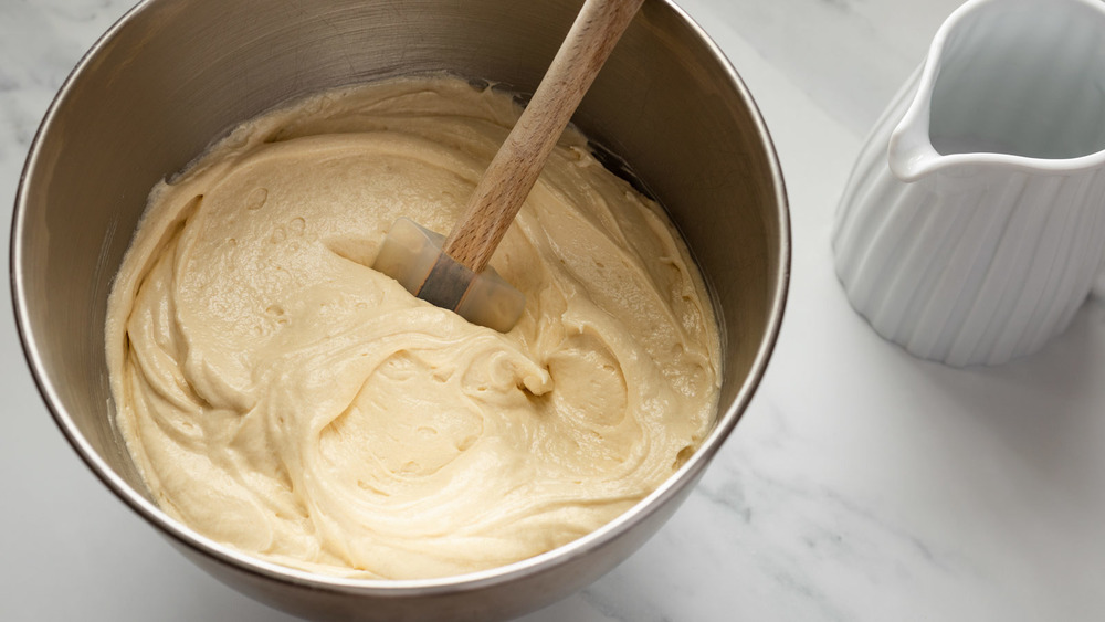 adding flour to classic vanilla cake recipe