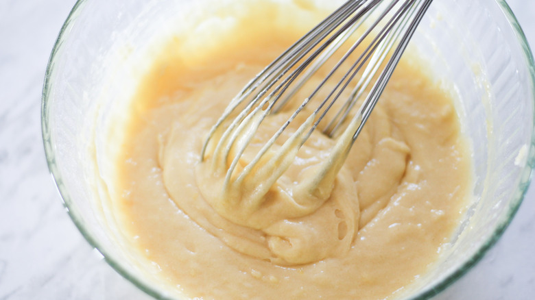 the pizzelle batter being whisked