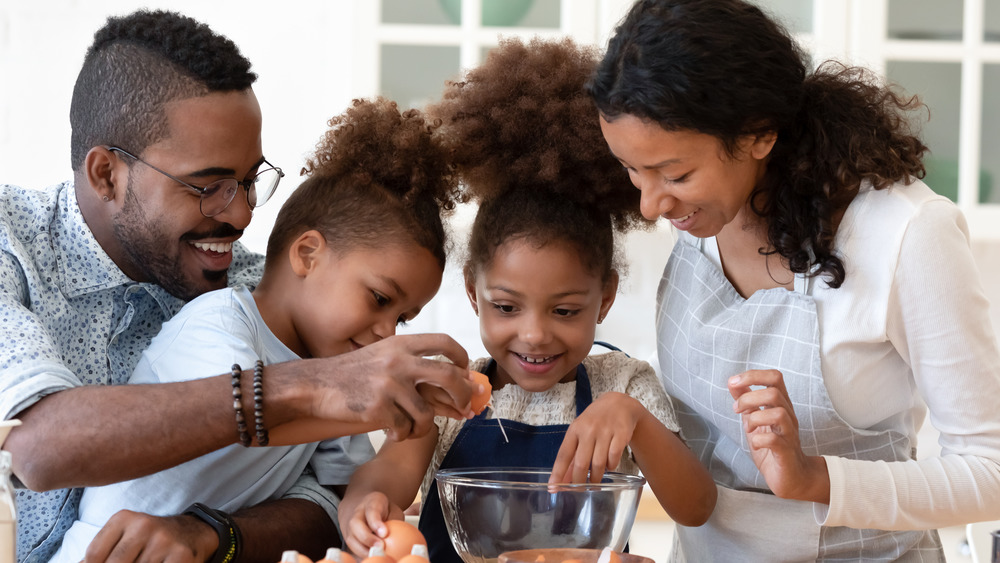 A family makes eggs together