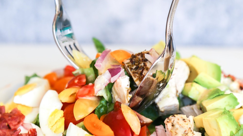 fork digging into Cobb salad recipe