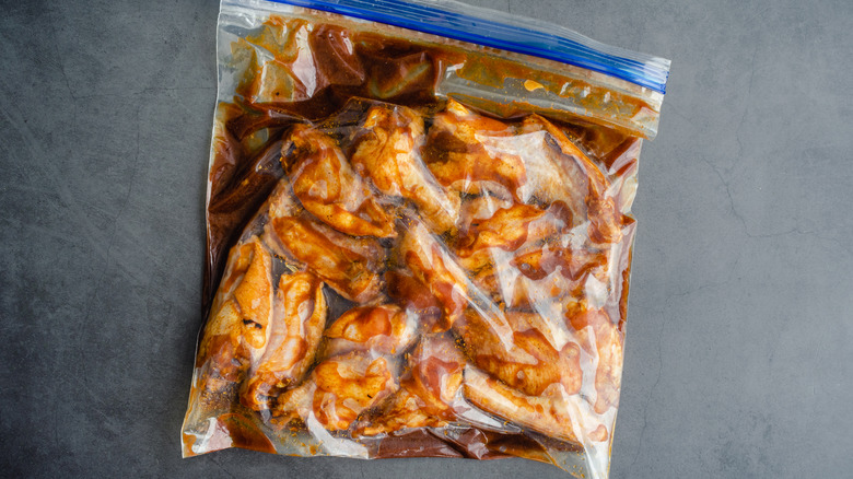 chicken wings marinating in bag