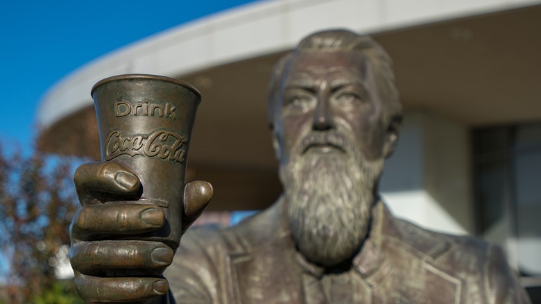 Statue of Pemberton holding a glass of Coca-Cola