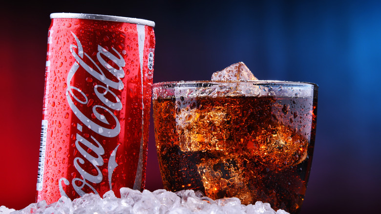 Coke can, glass, and ice