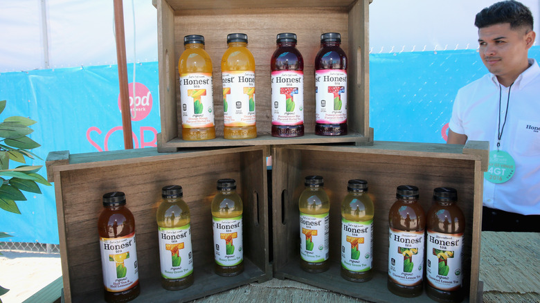 Honest tea bottles in a wooden display