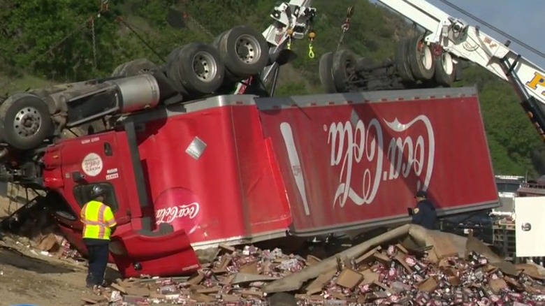 The tipped over Coke truck