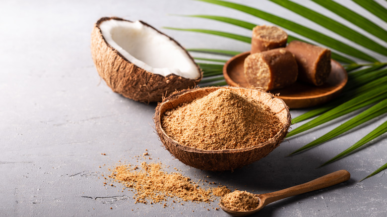 Coconut sugar inside coconut shell