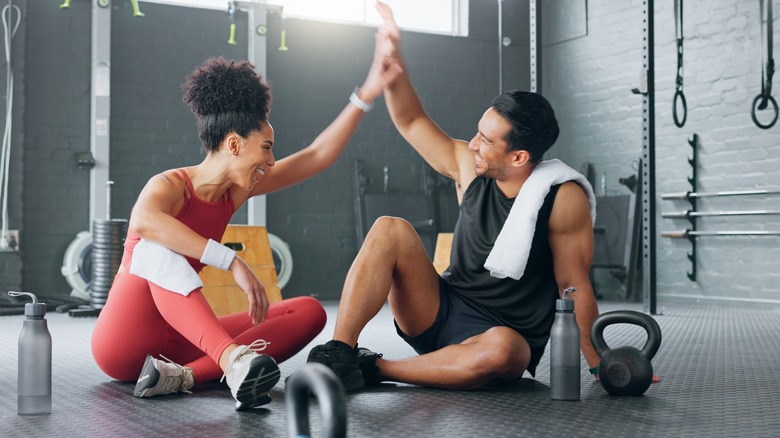 people high fiving after a workout