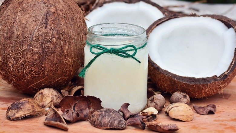 jar of coconut water with open coconut