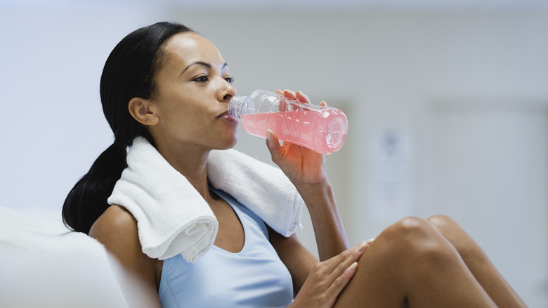 woman enjoying a sports drink