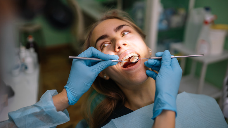 woman getting her teeth checked